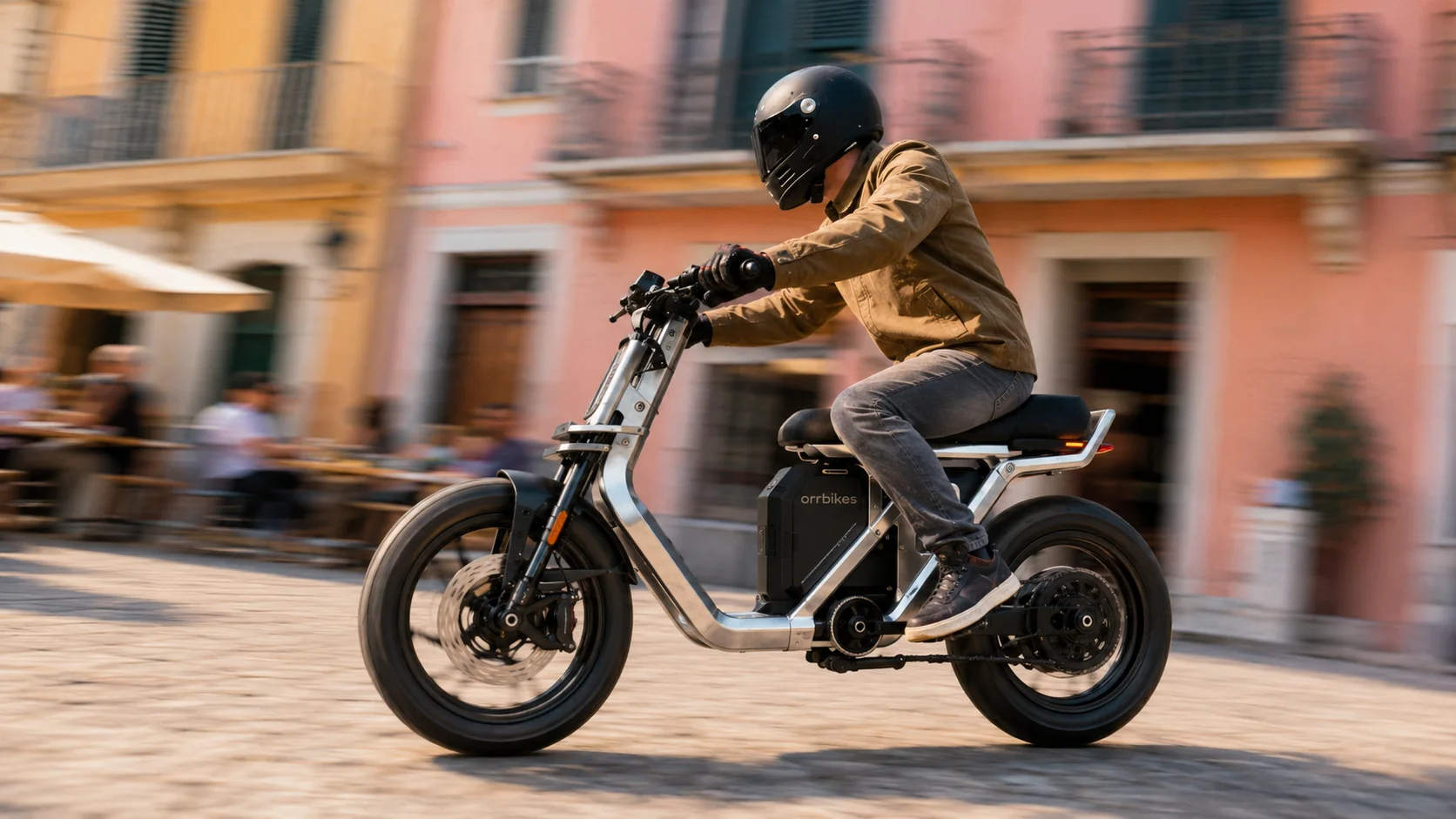 A rider on the ORRBIKES Urban Scooter in a daylight city street